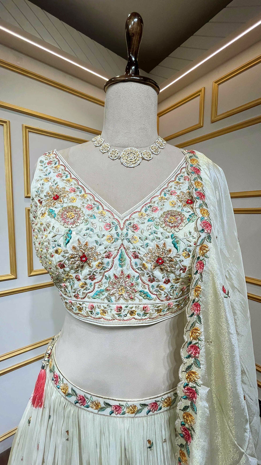 Crushed tissue lehenga with dabka & pearl work on choli in ivory gold