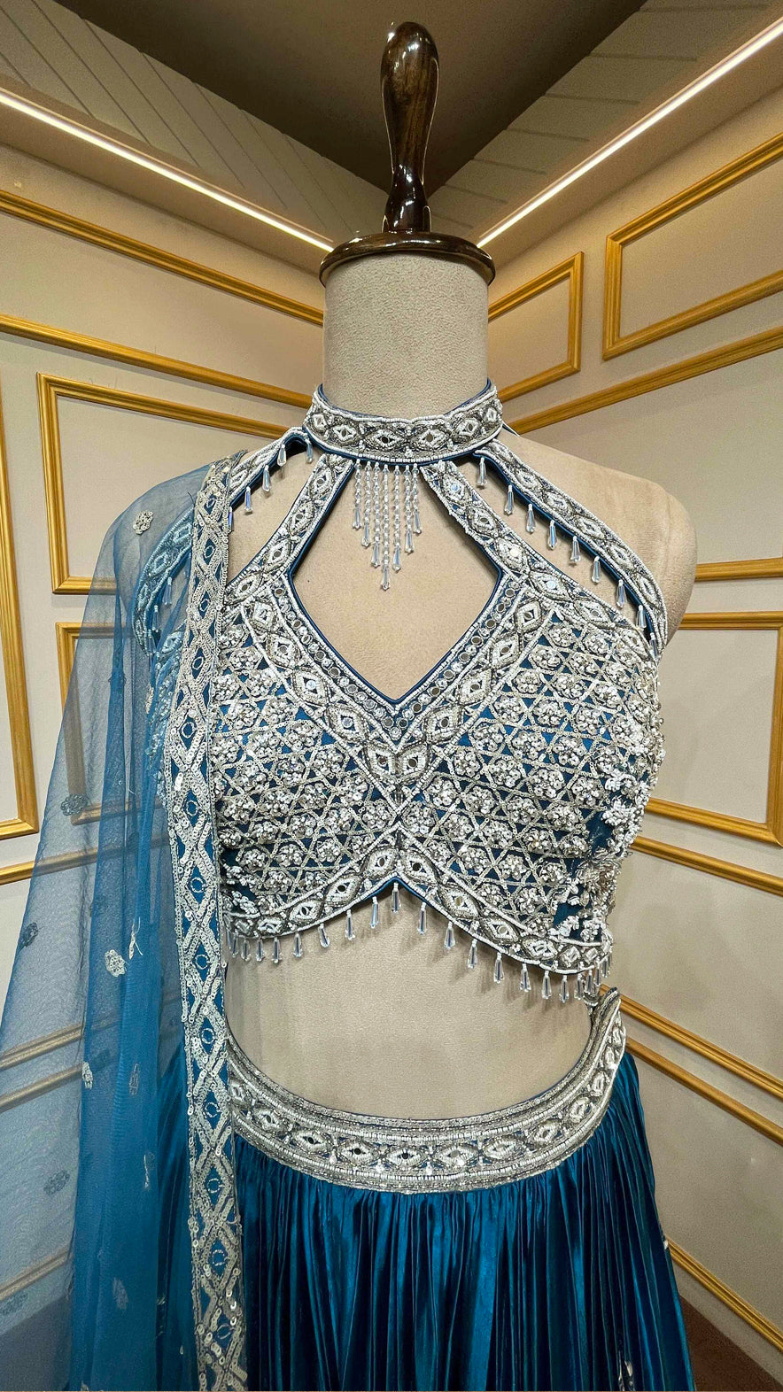 Peacock blue organza lehenga choli with pearl & sequins