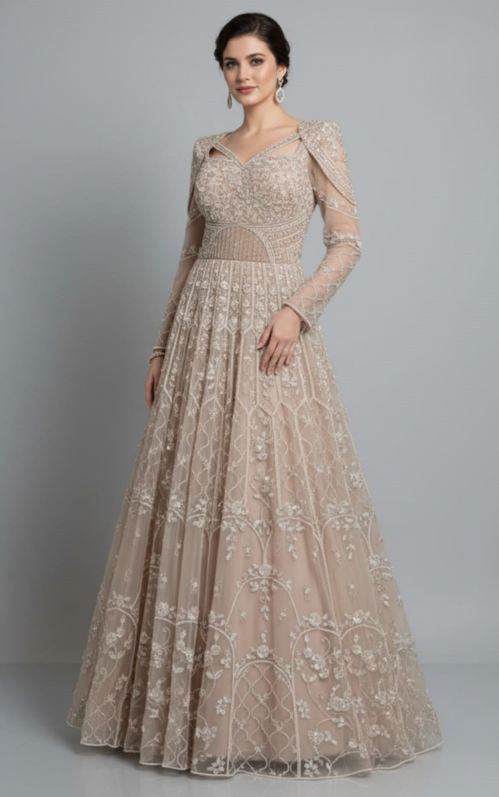 Full sleeves net engagement gown with pearl & cut dana work in soft gold