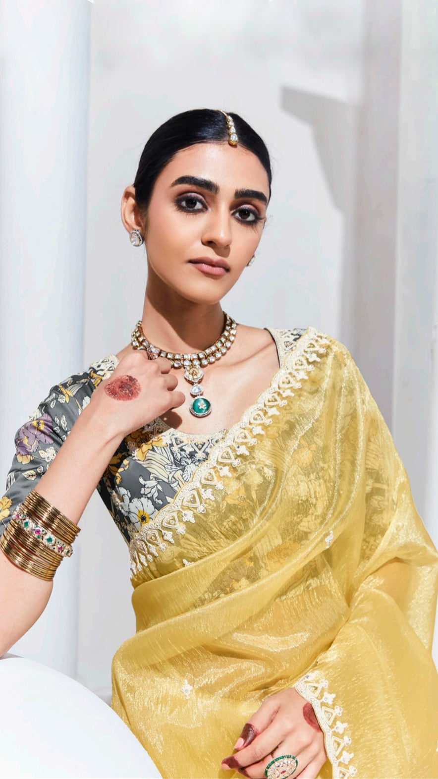 Organza saree with thread work border in pastel yellow and grey printed blouse