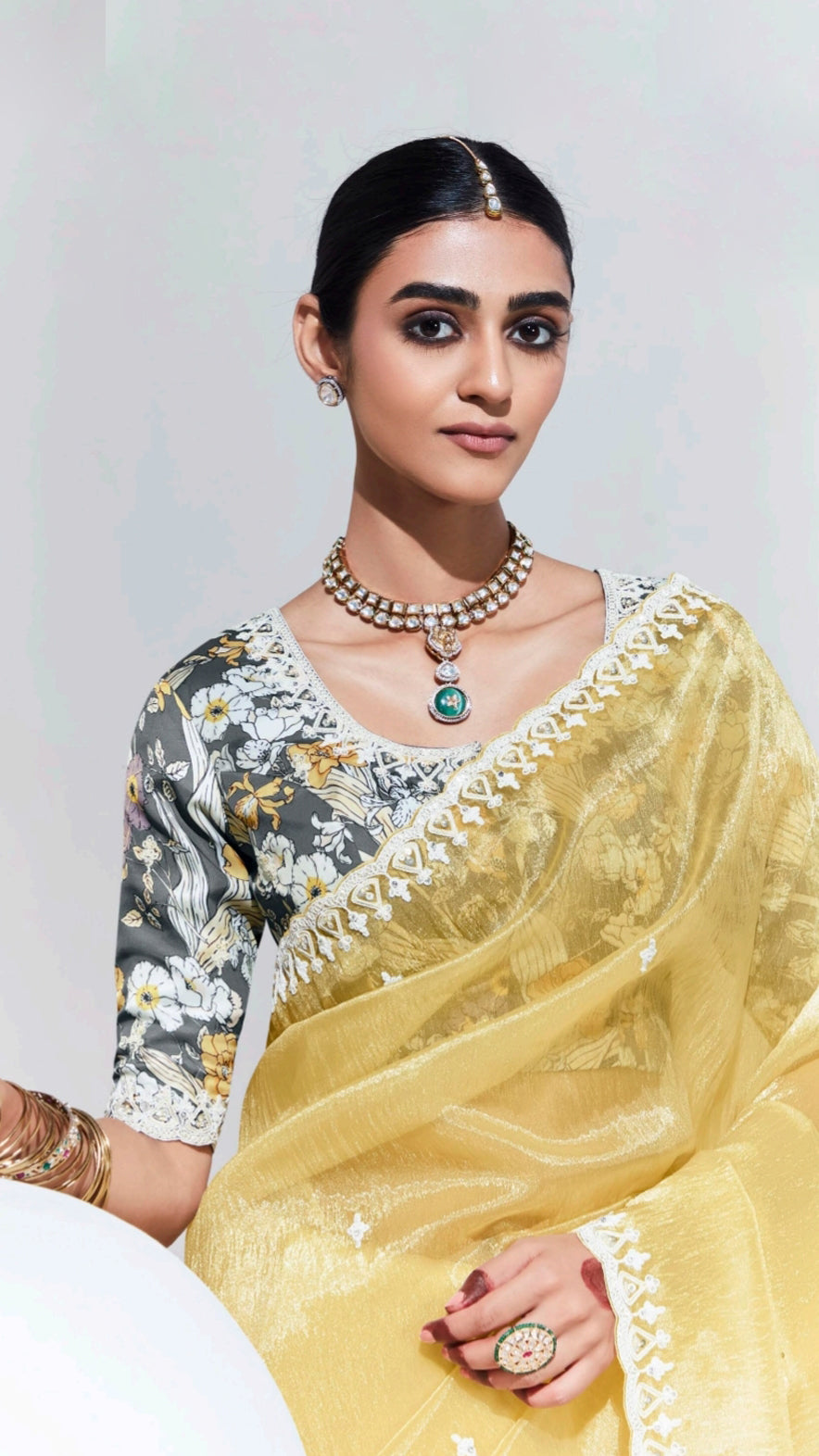 Organza saree with thread work border in pastel yellow and grey printed blouse