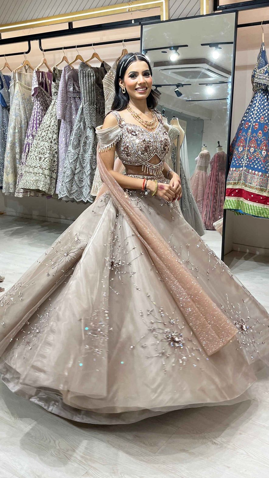 Mirror & pearl work on camel brown net ball lehenga