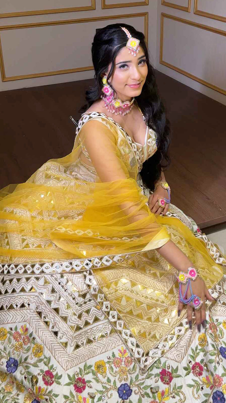 Cream lehenga choli in raw silk with multicolor thread & leather work and contrasting yellow dupatta