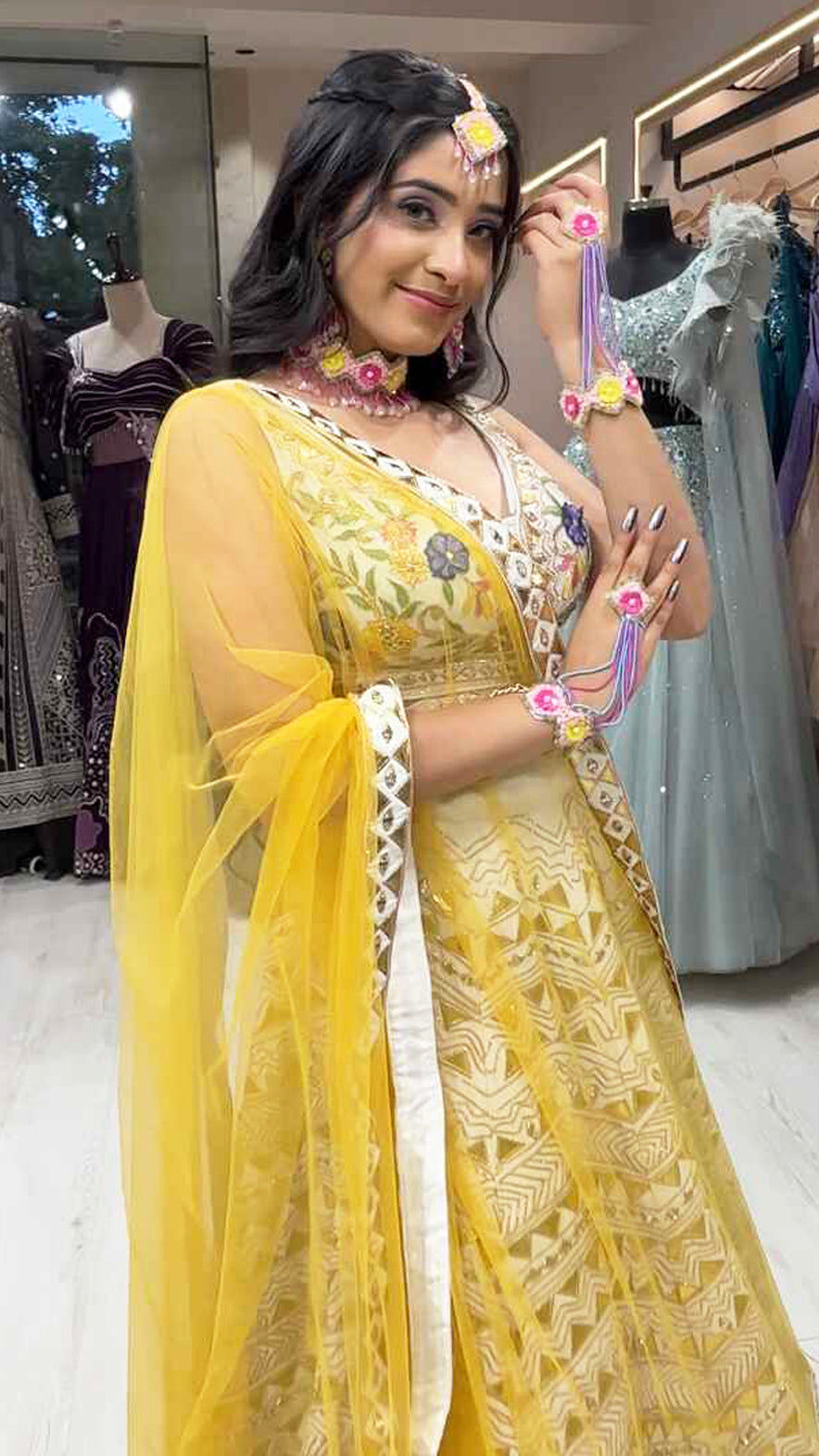 Cream lehenga choli in raw silk with multicolor thread & leather work and contrasting yellow dupatta