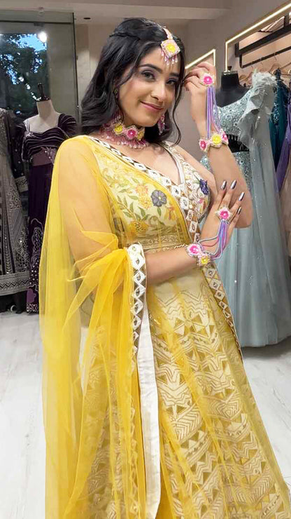 Cream lehenga choli in raw silk with multicolor thread & leather work and contrasting yellow dupatta