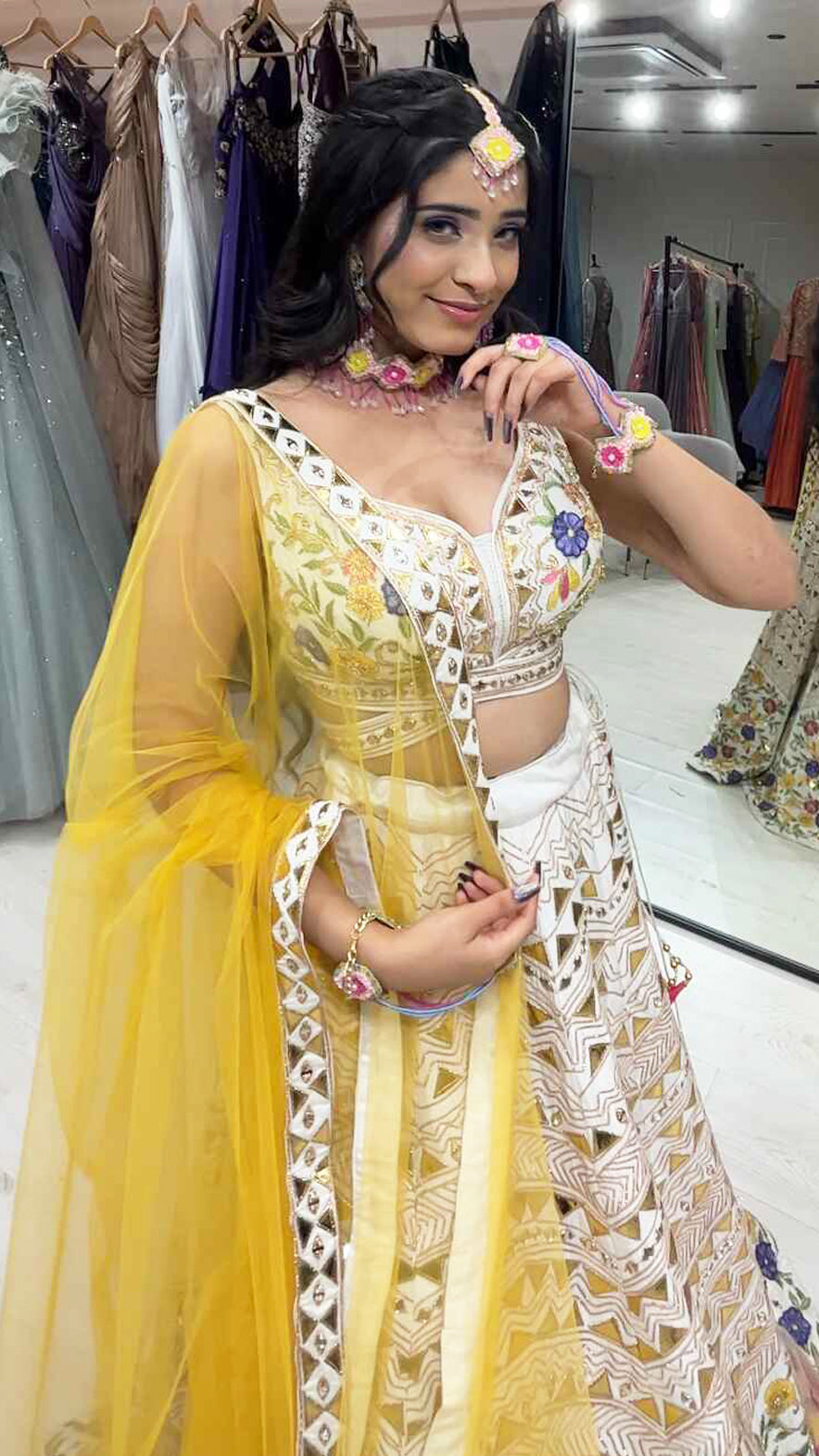 Cream lehenga choli in raw silk with multicolor thread & leather work and contrasting yellow dupatta