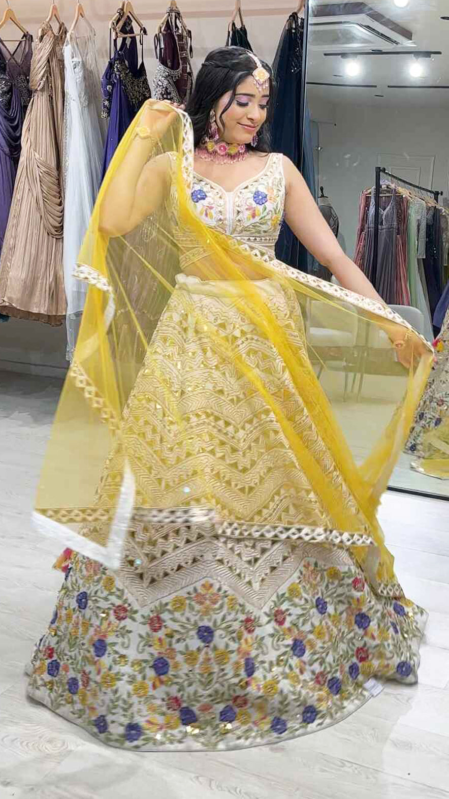 Cream lehenga choli in raw silk with multicolor thread & leather work and contrasting yellow dupatta