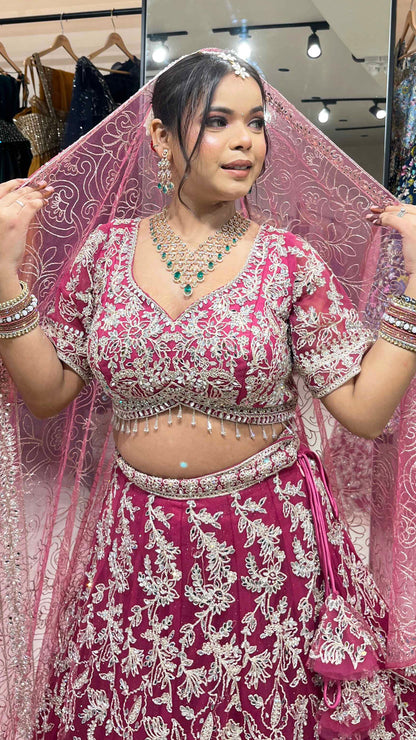 Magenta lehenga with zari & mirror on net with heavy dupatta