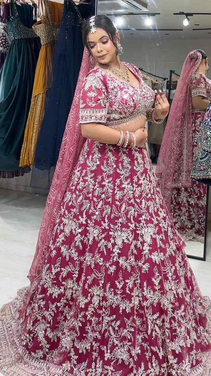 Magenta lehenga with zari & mirror on net with heavy dupatta