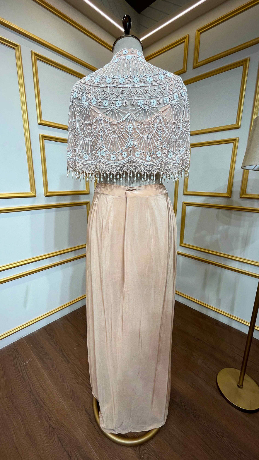 Powder peach dhoti style in crape with net poncho with pearl & tube work