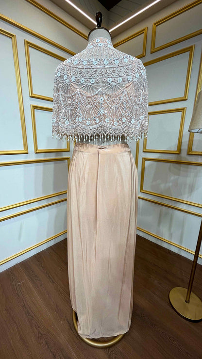 Powder peach dhoti style in crape with net poncho with pearl & tube work