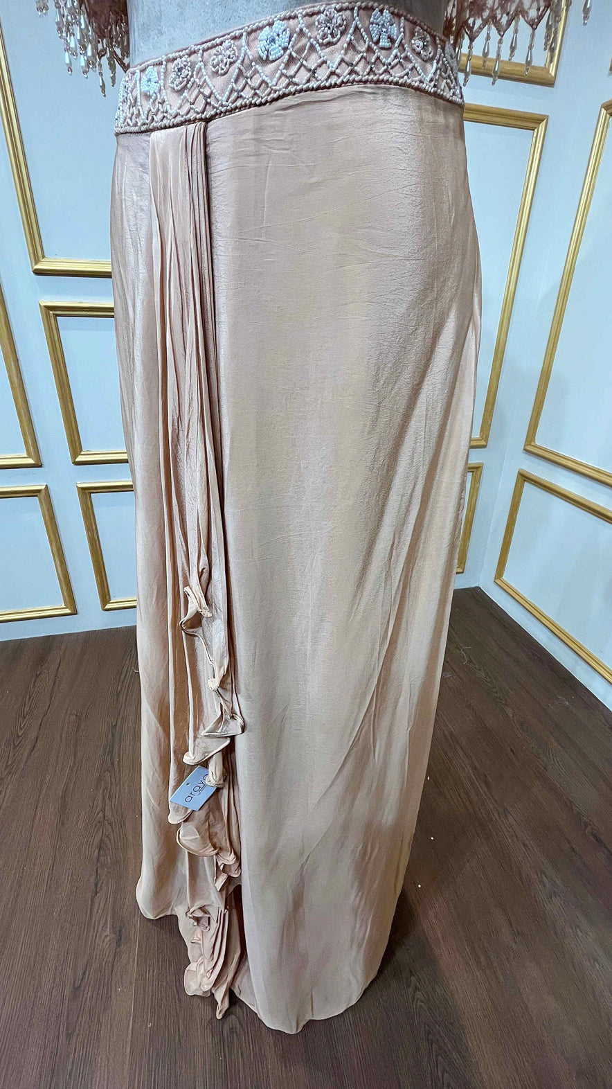 Powder peach dhoti style in crape with net poncho with pearl & tube work