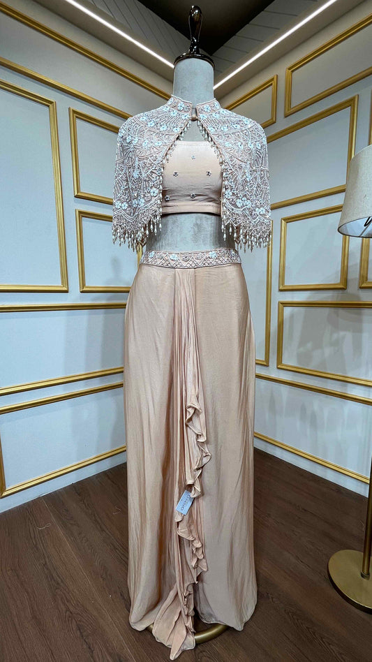 Powder peach dhoti style in crape with net poncho with pearl & tube work