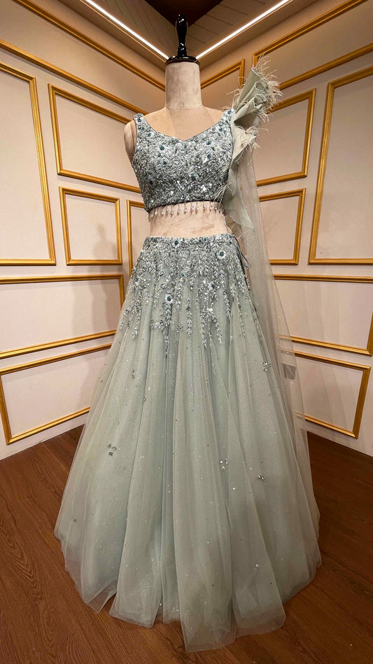 Powder mint green engagement lehenga with sequins & zarkan work on net