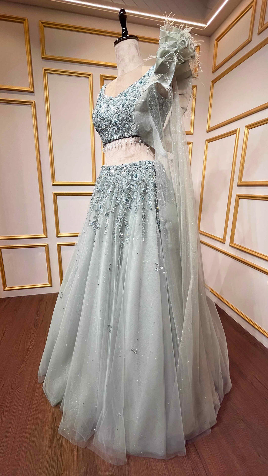 Powder mint green engagement lehenga with sequins & zarkan work on net