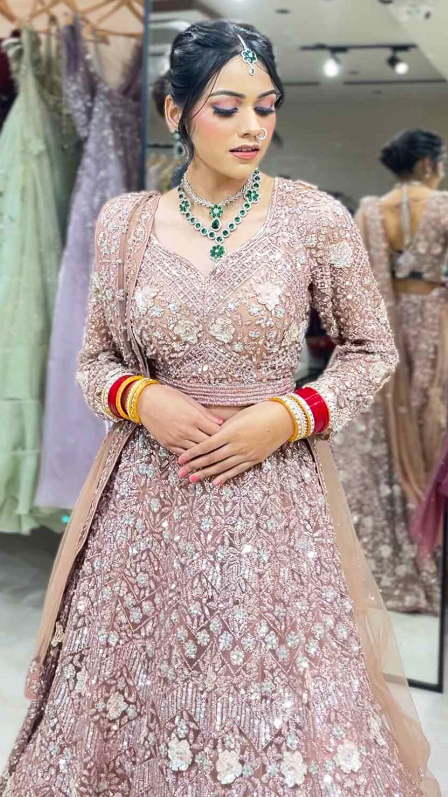 Dusty coral bridal lehenga in net with zarkan & swarovski along with four side border dupatta