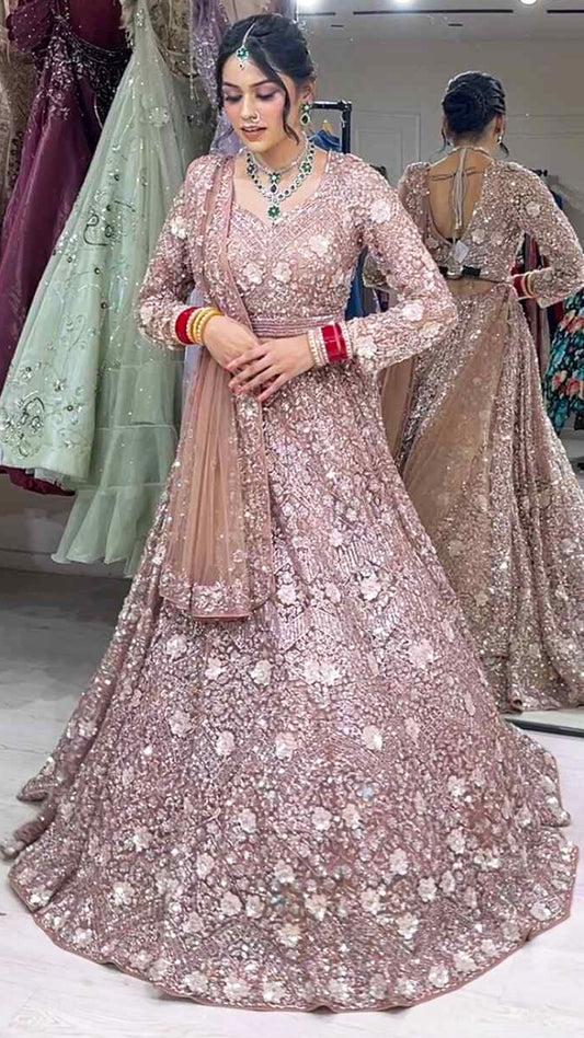 Dusty coral bridal lehenga in net with zarkan & swarovski along with four side border dupatta