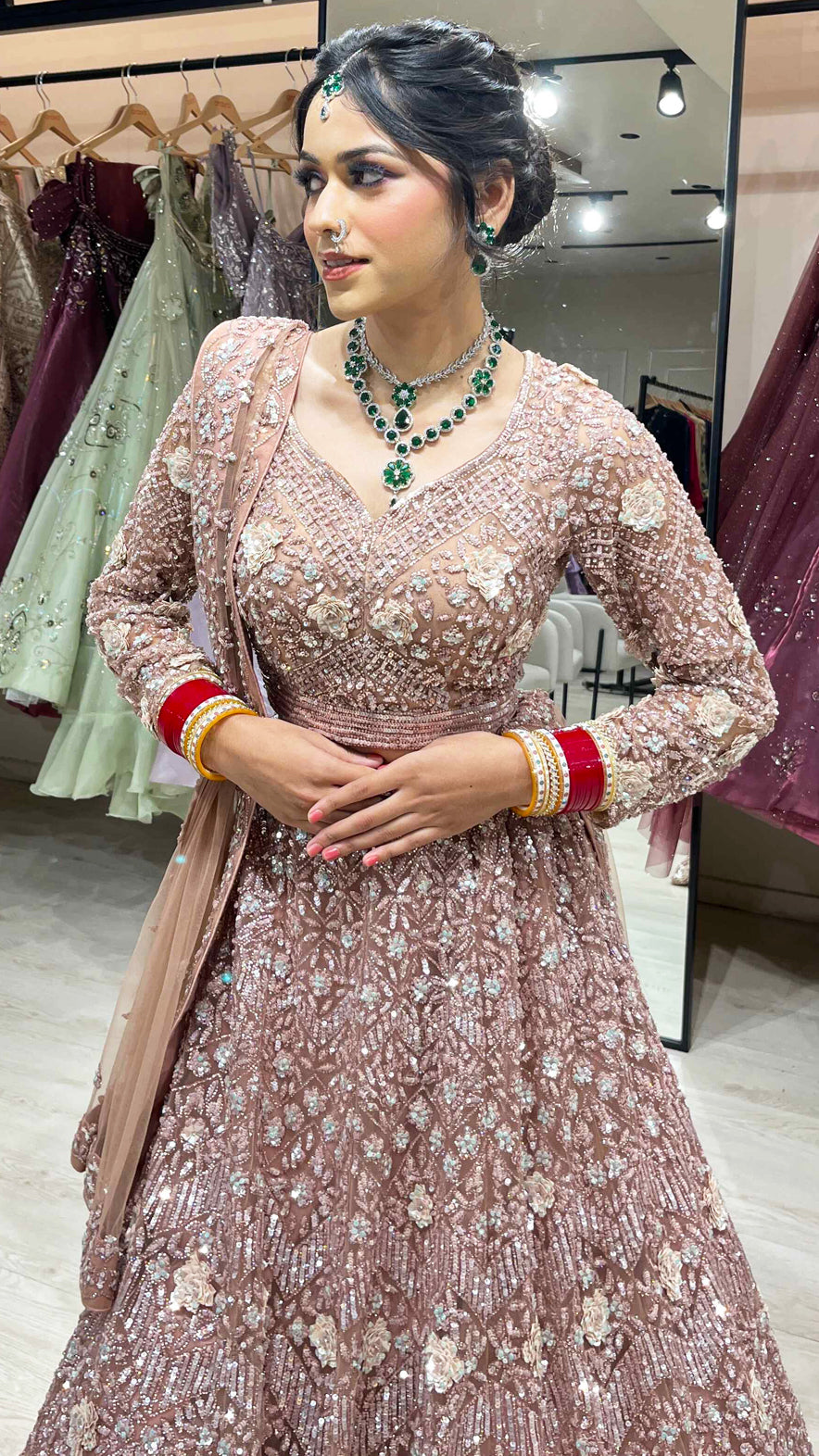 Dusty coral bridal lehenga in net with zarkan & swarovski along with four side border dupatta