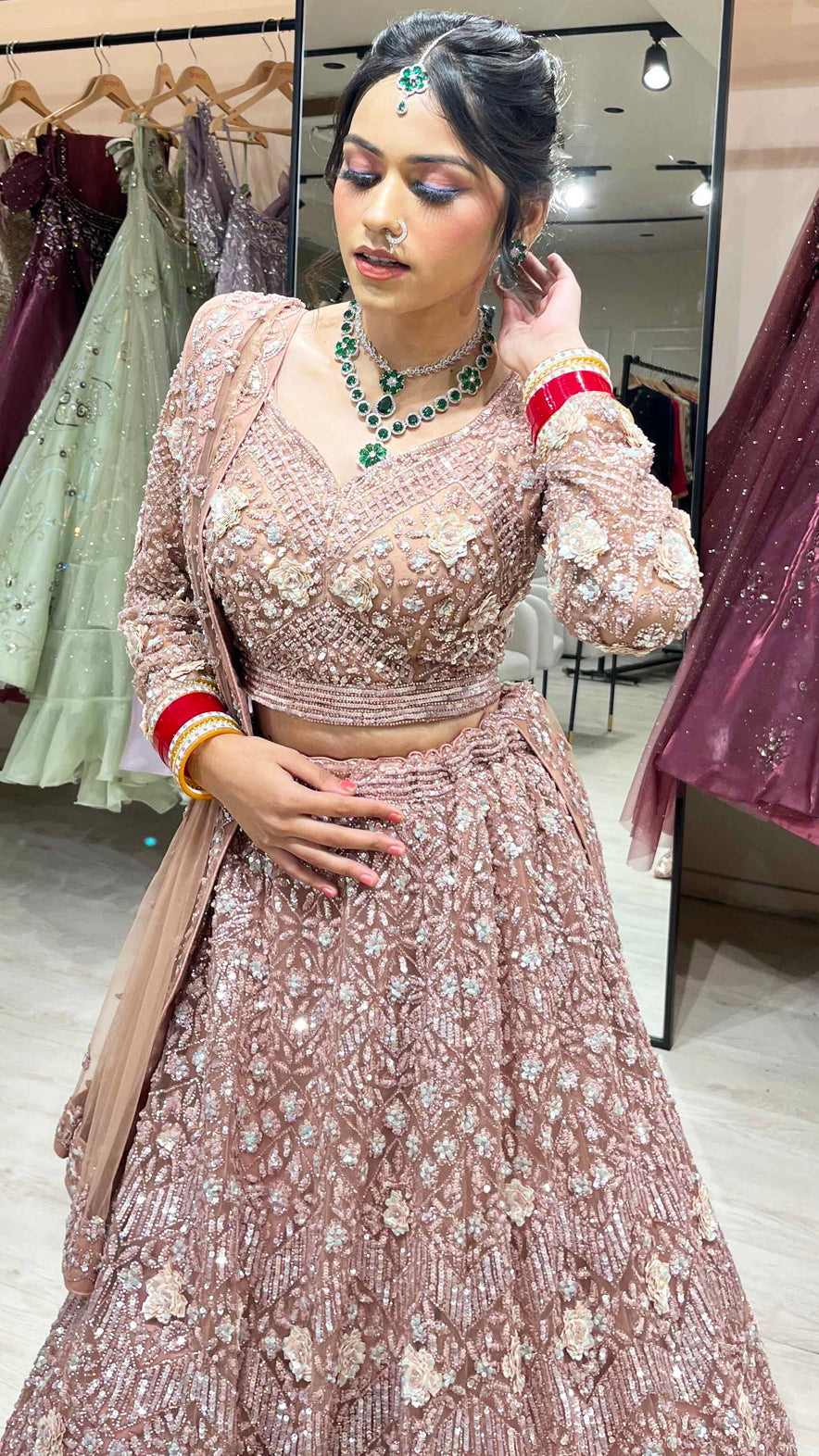 Dusty coral bridal lehenga in net with zarkan & swarovski along with four side border dupatta