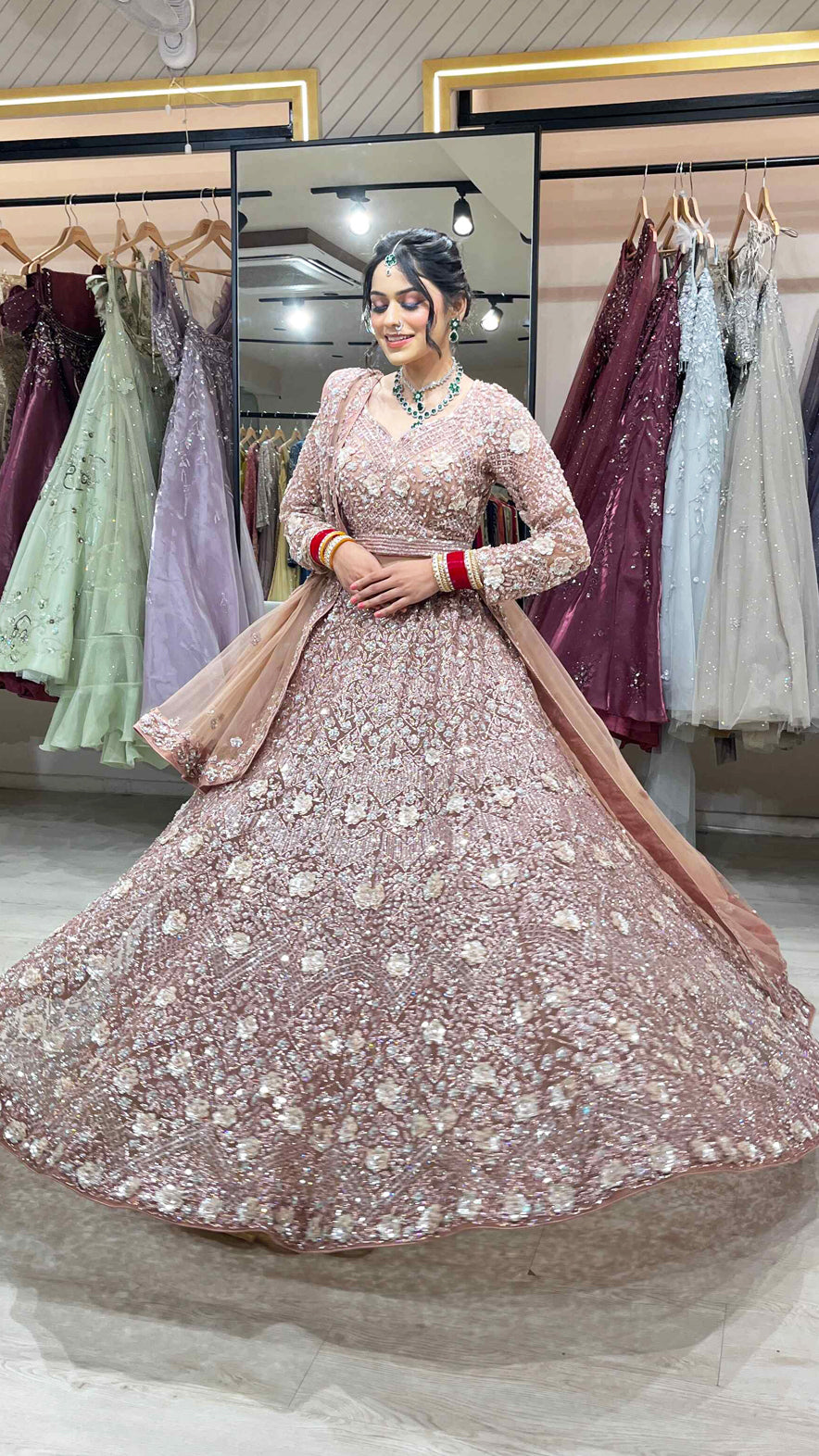 Dusty coral bridal lehenga in net with zarkan & swarovski along with four side border dupatta