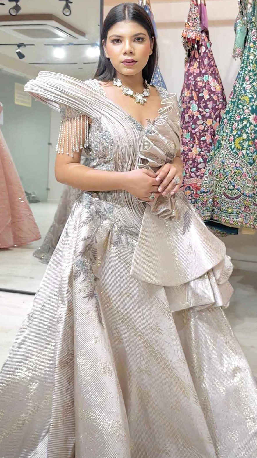 Pale gold imported wrinkled fabric engagement gown with zari & pearl work