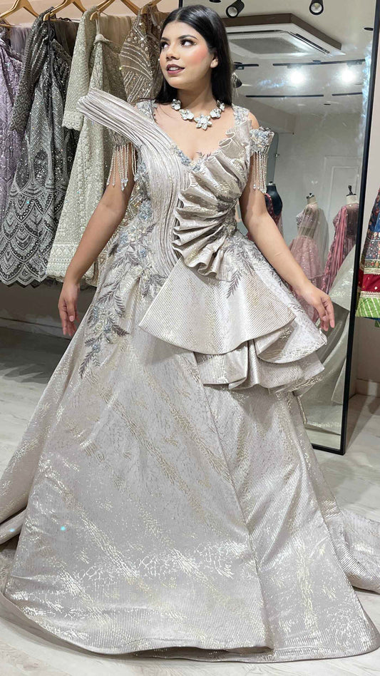 Pale gold imported wrinkled fabric engagement gown with zari & pearl work