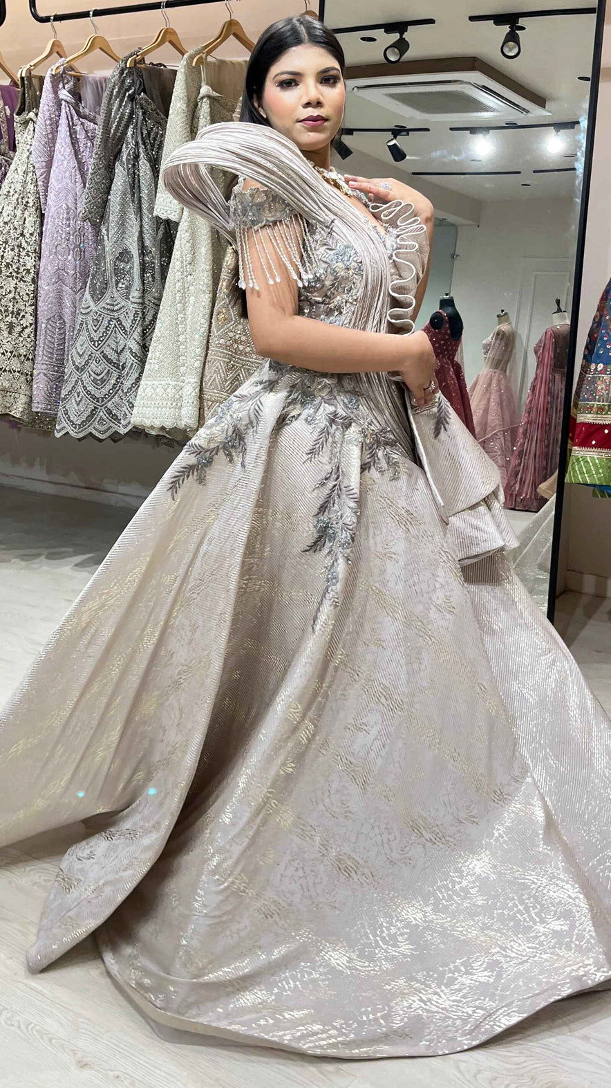 Pale gold imported wrinkled fabric engagement gown with zari & pearl work