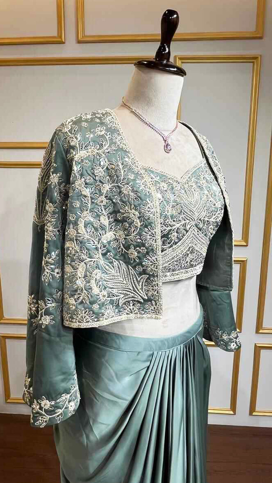 Satin dhoti skirt with thread & crystal work crop top and jacket in pine green