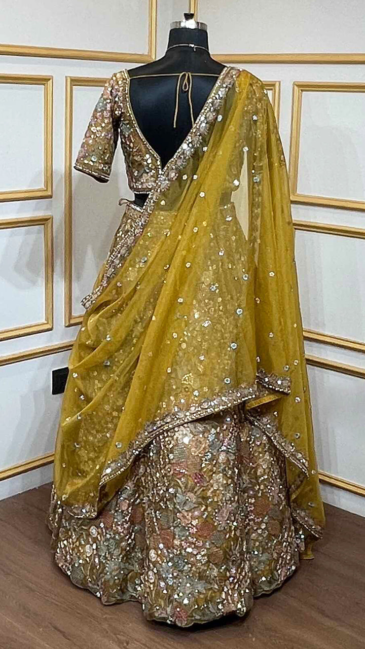 Thread & pearl work on dusty mustard lehenga in organza with heavy dupatta
