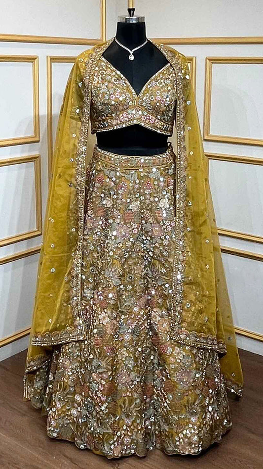 Thread & pearl work on dusty mustard lehenga in organza with heavy dupatta