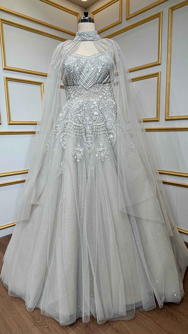 Net engagement gown with zarkan & cut dana work and detachable neck collar in nude beige