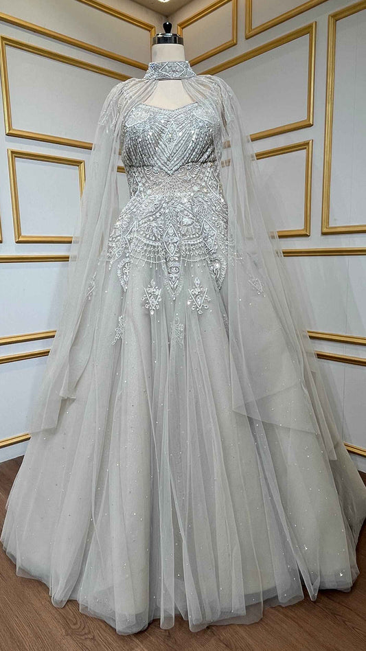 Net engagement gown with zarkan & cut dana work and detachable neck collar in nude beige