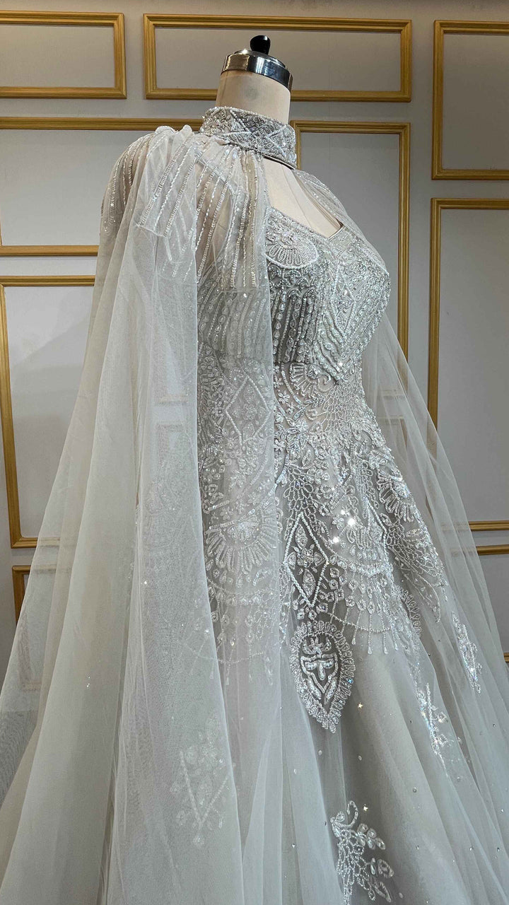 Net engagement gown with zarkan & cut dana work and detachable neck collar in nude beige
