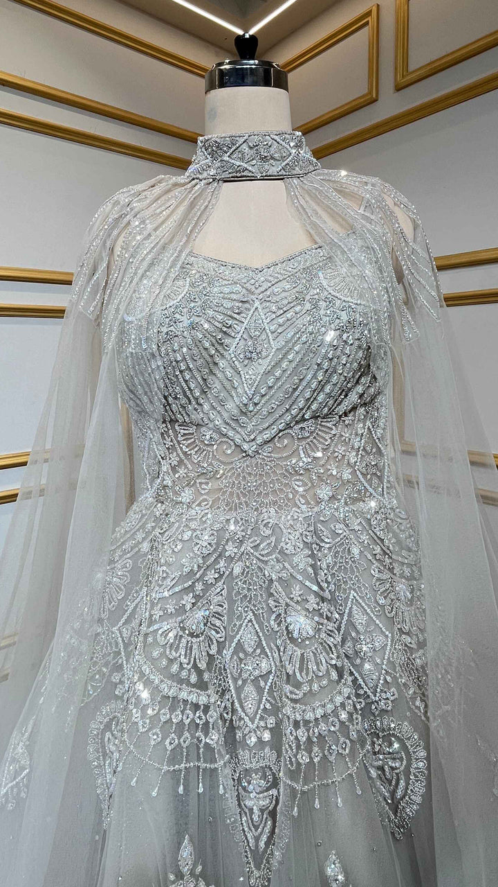 Net engagement gown with zarkan & cut dana work and detachable neck collar in nude beige