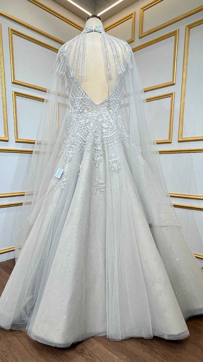 Net engagement gown with zarkan & cut dana work and detachable neck collar in nude beige