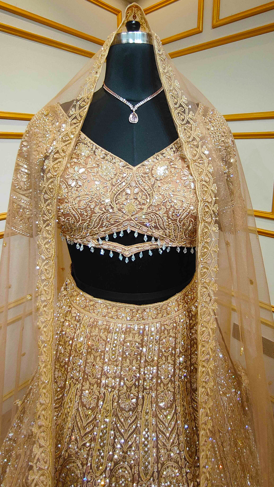 Resham & zarkan work on copper lehenga with heavy dupatta in net
