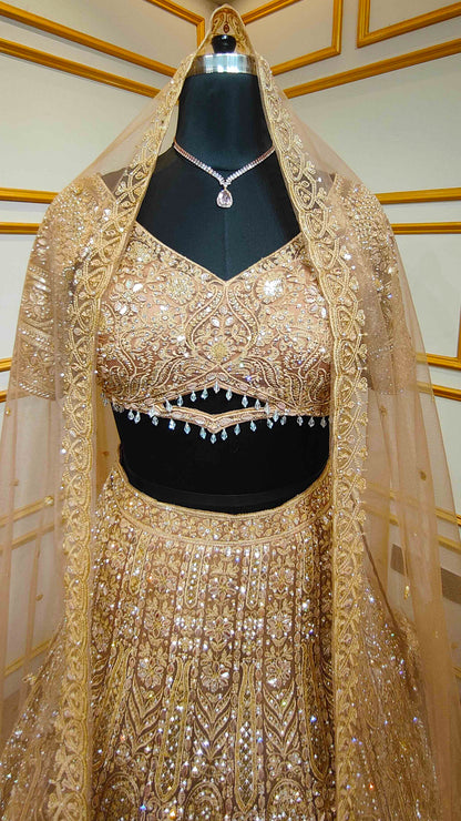 Resham & zarkan work on copper lehenga with heavy dupatta in net