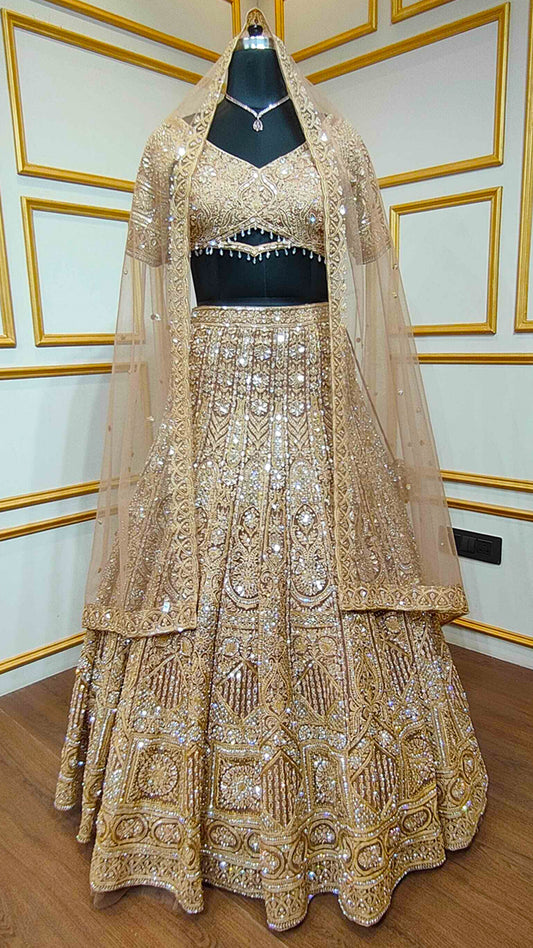 Resham & zarkan work on copper lehenga with heavy dupatta in net
