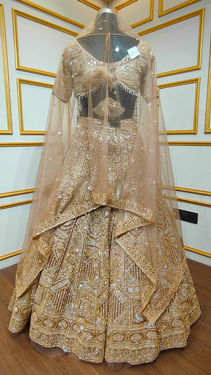 Resham & zarkan work on copper lehenga with heavy dupatta in net