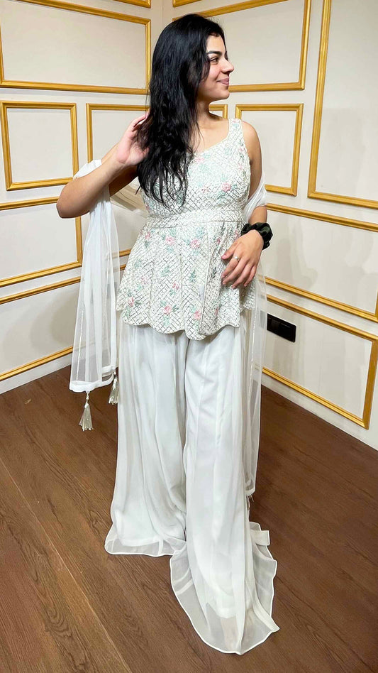 Off white peplum top with sequins & swarovski along with georgette plazo