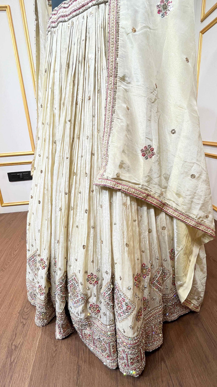 Golden beige lehenga with pearl & zari work on chinon