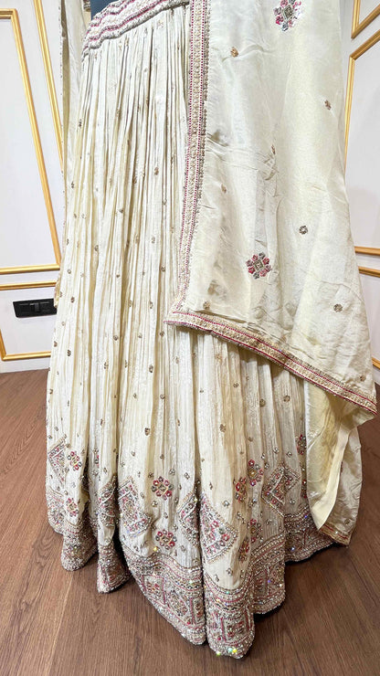 Golden beige lehenga with pearl & zari work on chinon