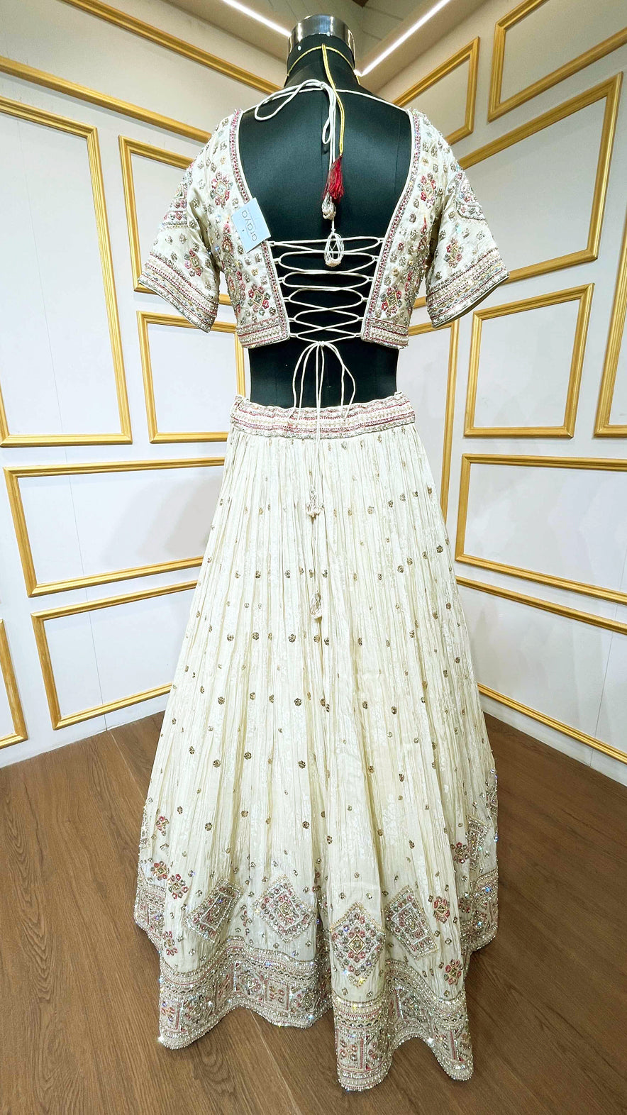 Golden beige lehenga with pearl & zari work on chinon