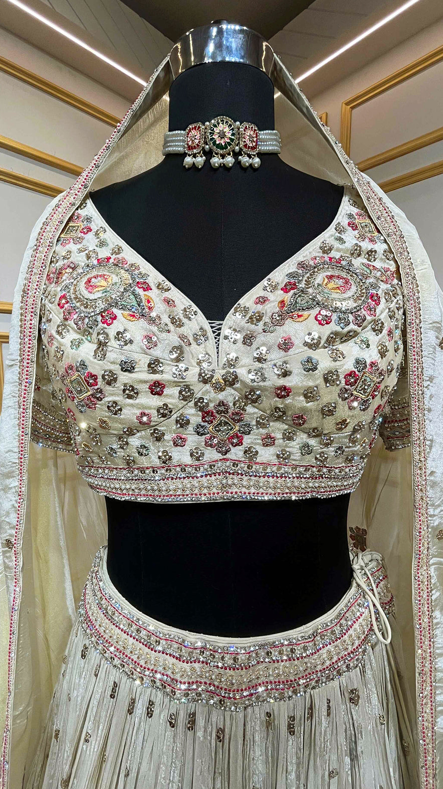Golden beige lehenga with pearl & zari work on chinon