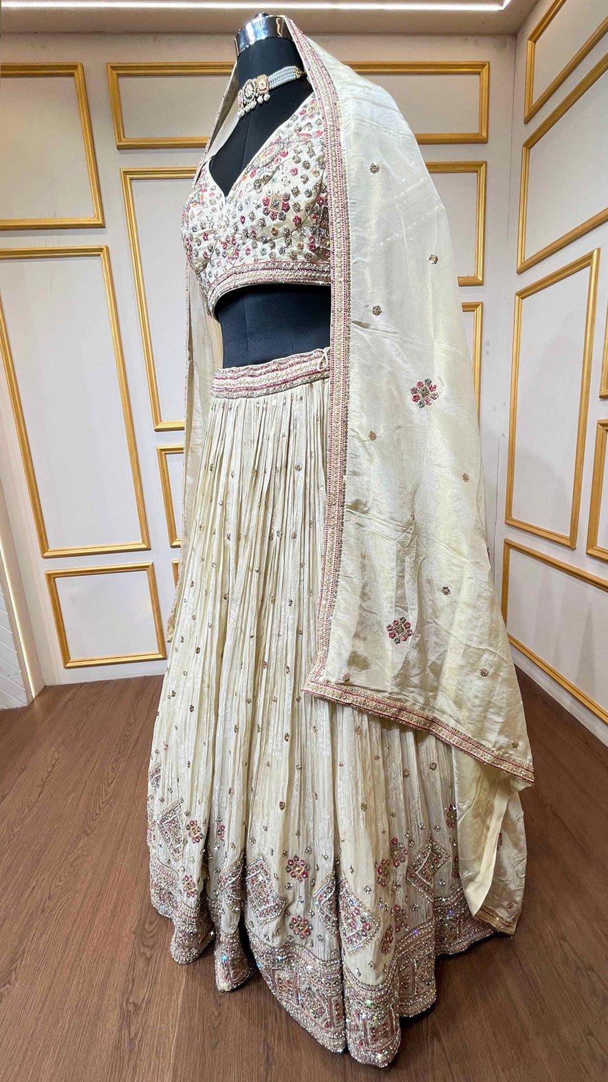 Golden beige lehenga with pearl & zari work on chinon