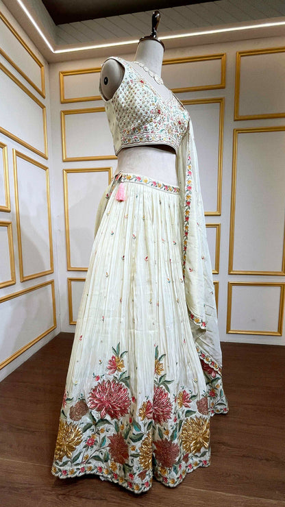 Crushed tissue lehenga with dabka & pearl work on choli in ivory gold