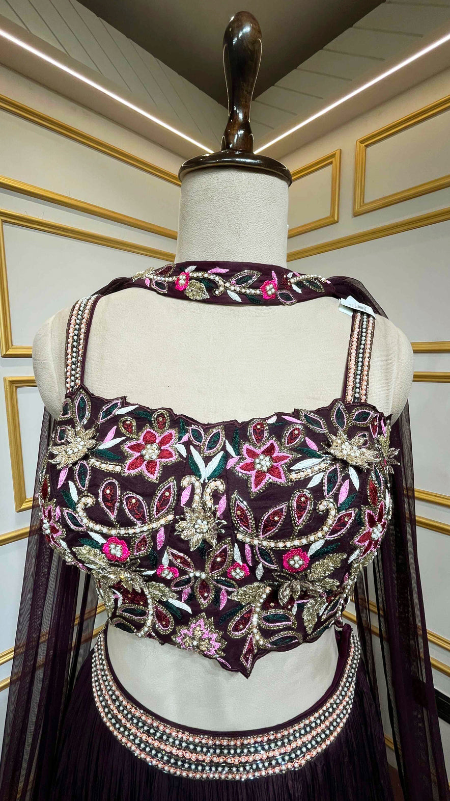 Wine lehenga with resham & cut dana work on choli in crushed georgette