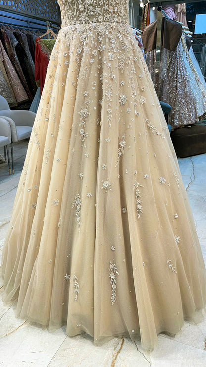Golden cream net gown with sequins & zarkan work