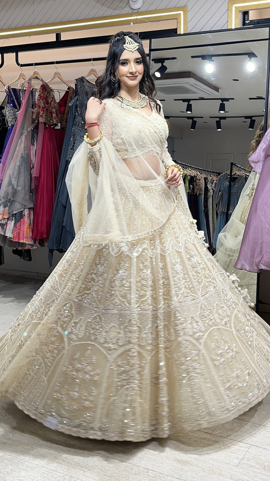 Tube & pearl work on net ivory cream lehenga along with four side border dupatta