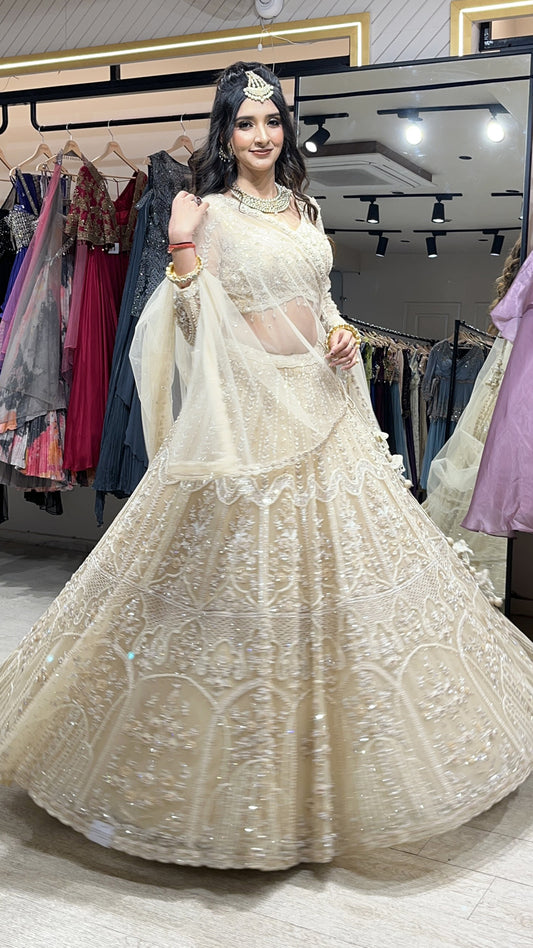 Tube & pearl work on net ivory cream lehenga along with four side border dupatta